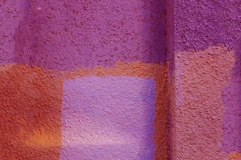 The wall surface is painted in different colors. Stock Photos