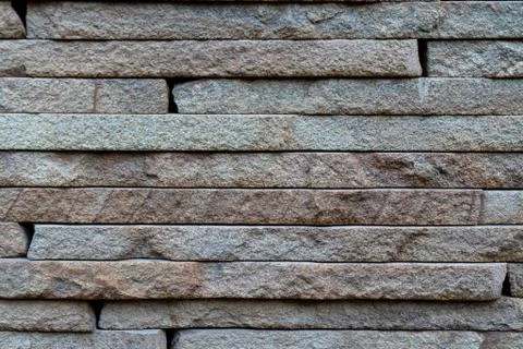 Wall surface texture of hewn stone, natural stone bricks Stock Photos