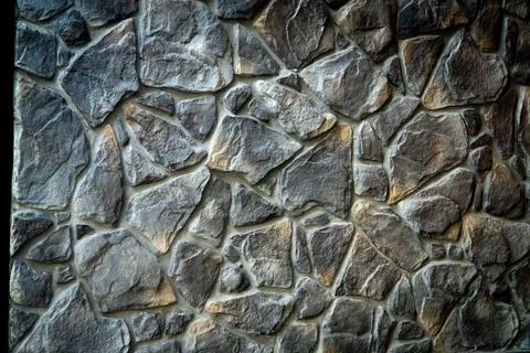 The wall surface, which is closed with granite, continuously arranged. Stock Photos