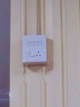 A wall with a switch Stock Photos