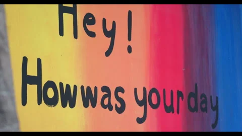 Wall Text Saying "Hey! How was your day" on Colorful Background Stock Footage 328549269