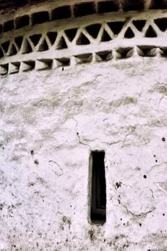 Wall texture and a narrow window of medieval church, Pskov. Russ Stock Photos