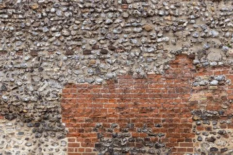 Wall Texture with cobbles and red bricks for graphic design Stock Photos