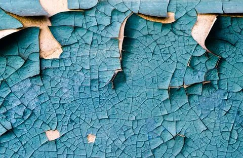 Wall texture with cracked peeling blue paint Stockfoto's