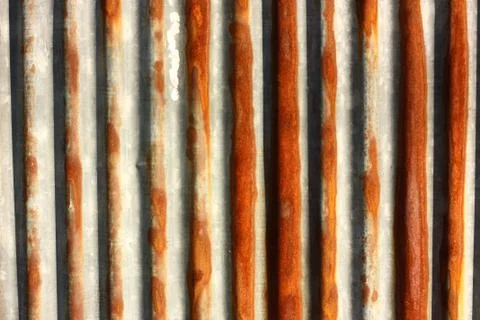 Wall texture of metal rusty sheet macro Stock Photos