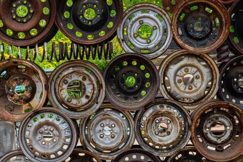 Wall, texture from old welded wheel discs of cars. Stock Photos