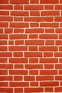 The wall texture is red brick. Background Stock Photos