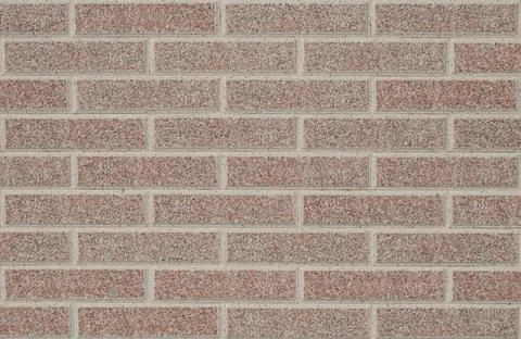 Wall texture in small stone blocks, bricks Stock Photos