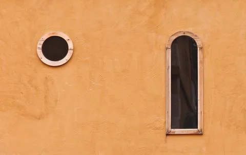 Wall texture with windows Stock Photos