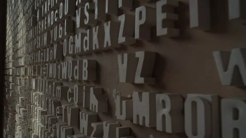 Wall with three-dimensional letters and symbols on it Stock Footage 271626815
