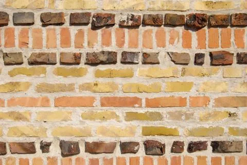 Wall tile pattern made of different clay bricks Stockfoto's