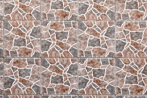 Wall tiled with giraffe skin pattern. Stock Photos