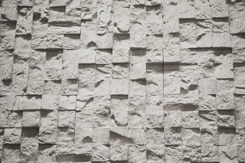 Wall tiles in the form of small white and gray cubes, pixels Stock Photos