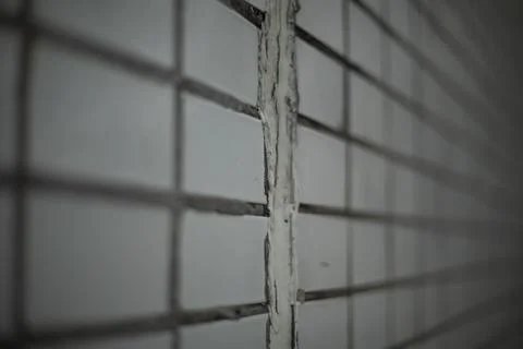 Wall of tiles. Tiles in cladding of building. Wall details. Stock Photos
