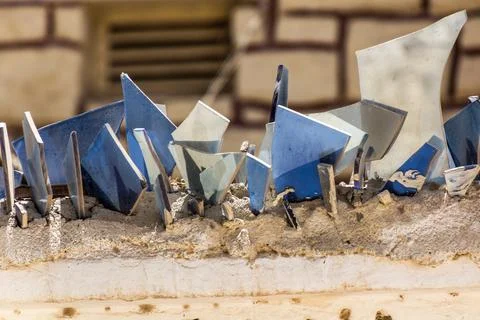 Wall topped with sharp shards for the protection against intruders Stockfoto's