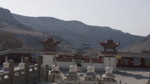 A wall with two small towers at a buddhist monistary Stock Footage 75212036