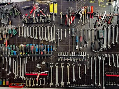 A wall of various mechanic tools organized neatly. Stock Photos
