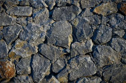 Wall with various size and shaped stones 2 Stock Photos