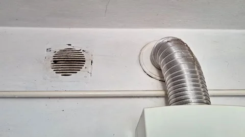 Wall Vent and Flexible Air Duct Installed Above Household Appliance 스톡 동영상 340121778