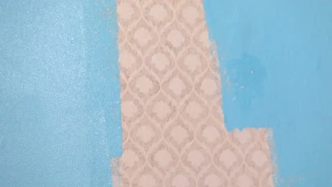 Wall with wallpaper painted in blue Stock Footage 113788584