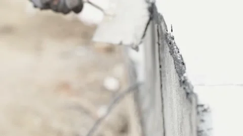 Wall waterproofing. Flame of fire from a gas burner to heat asphalt belts for Stock Footage 239268087
