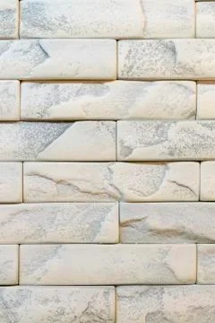 Wall of white brick. background. Wall of white-gray brick. Stock Photos