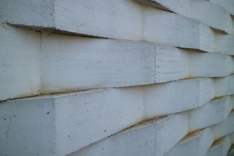 Wall of white bricks arranged in a zig zag Stock Photos