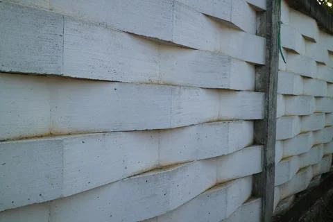 Wall of white bricks arranged in a zig zag Stock Photos