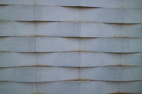 Wall of white bricks arranged in a zig zag Stock Photos