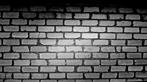 A wall of white bricks circlre light Stock Footage 98418693