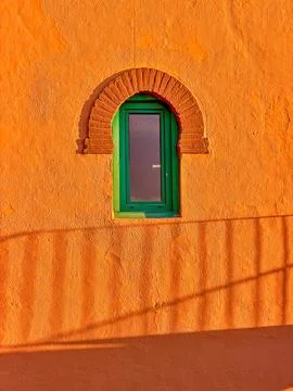 Wall, Window, And Shadow Of A Handrail Stock Photos