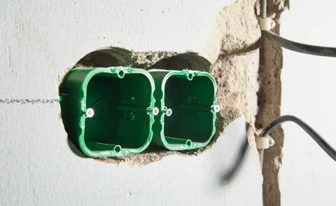 Wall with wire in socket holes. Preparation before installing socket Stock Photos