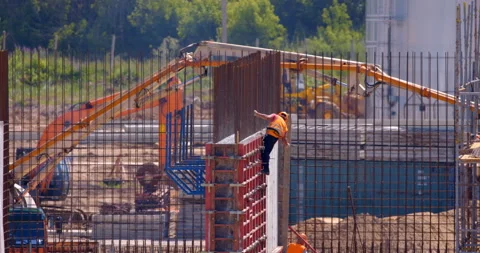 Wall of the workshop under construction is in formwork and poured with concrete Stock Footage 162017831