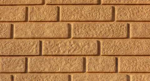 Wall of yellow bricks as an abstract background Stockfoto's