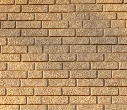 Wall of yellow bricks as an abstract background Stock Photos