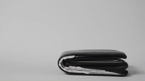 Wallet Falling In Slow Motion On White Stock Footage 60802695