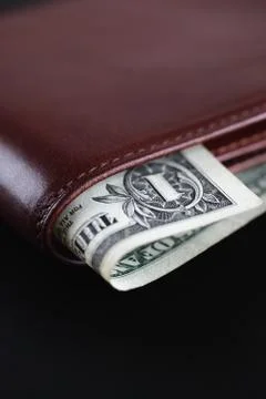Wallet with one dollar Stock Photos
