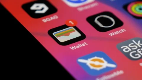 Wallet or Passbook app close up shot. iPhone financial organizer. Opening Stock Footage 123890929