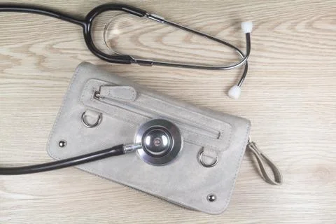 Wallet with a stethoscope Stock Photos