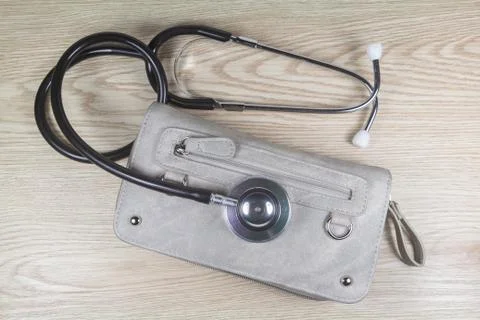 Wallet with a stethoscope Stock Photos