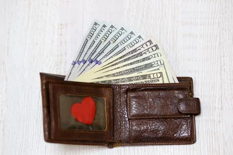Wallet with various dollar bills Stock Photos