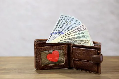 Wallet with various dollar bills Stock Photos