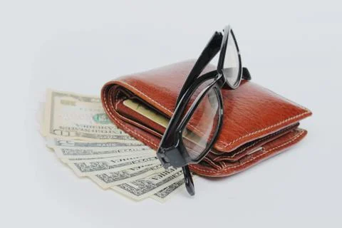Wallets and glasses on a white background Stock-Fotos