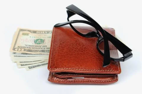 Wallets and glasses on a white background Stock Photos