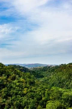 Walley between two hills covered by trees in Tuscany Stock Photos