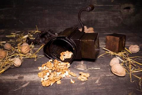 Wallnuts and hand walnuts grinder Stock Photos