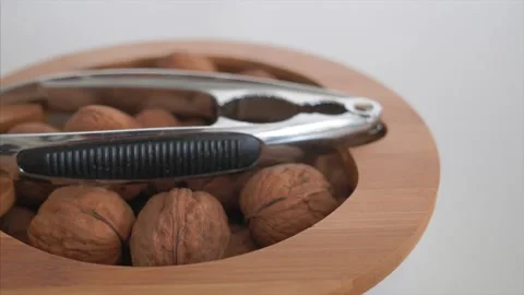 Wallnuts with nutcracker in the bowl Stock Footage 131108418