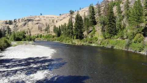 Wallowa river flowing through rural Wallowa County, Oregon, USA (4k) Stock Footage 136765149