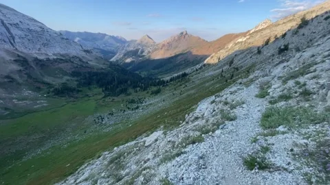 Wallowas Eagle Cap Wilderness: descending Hawkins Pass morning light Video stock 329454972