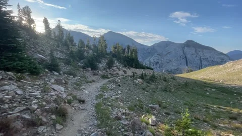 Wallowas Eagle Cap Wilderness: sun shines bright approaching Frazier Lake Video stock 329454964
